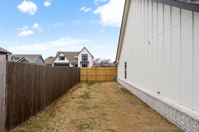 view of yard with a fenced backyard