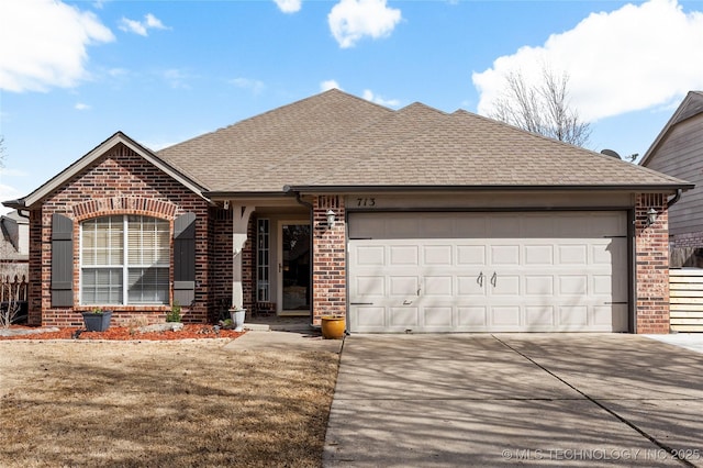 view of front of home featuring brick siding, an attached garage, and roof with shingles