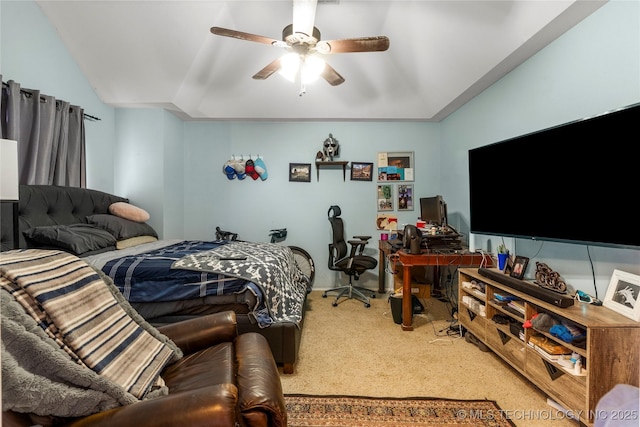 bedroom featuring a ceiling fan, lofted ceiling, and carpet flooring