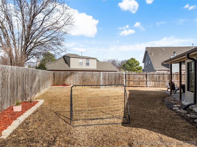 view of yard featuring a patio area and a fenced backyard