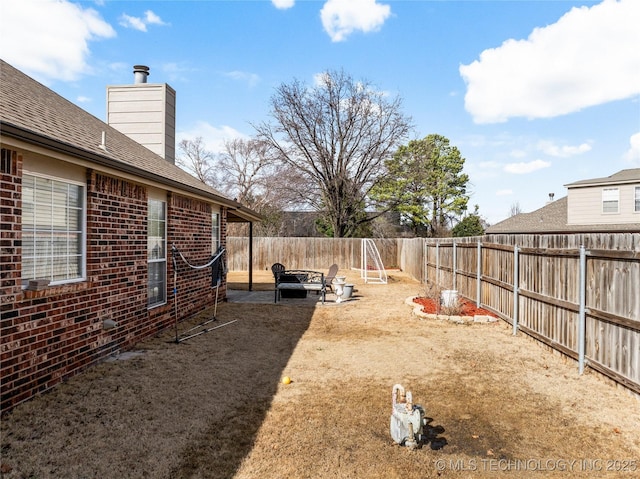 view of yard featuring a fenced backyard