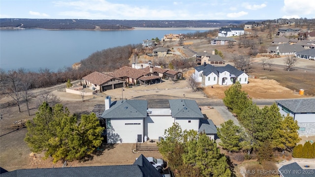 bird's eye view featuring a water view and a residential view