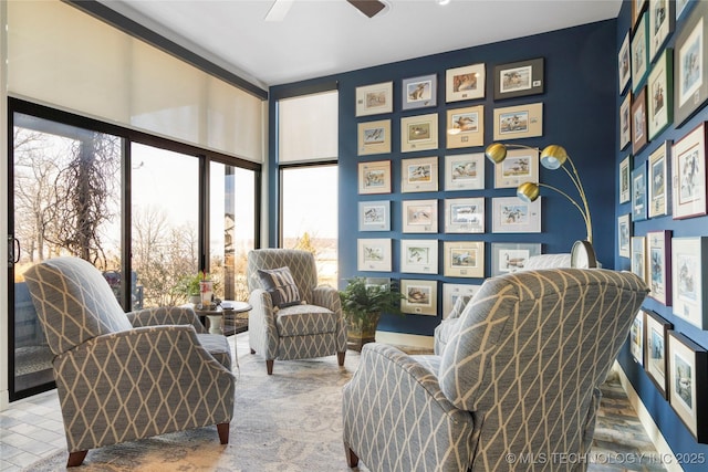 living area with ceiling fan