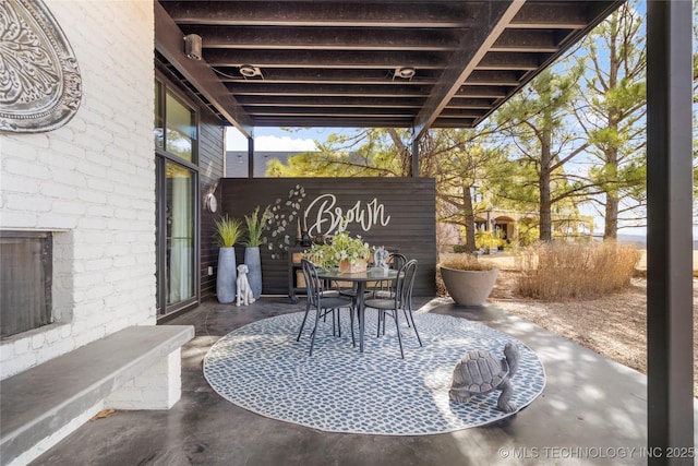 view of patio with outdoor dining area