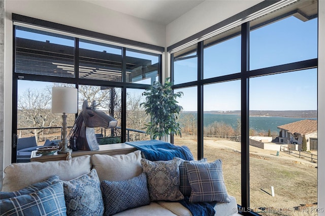 sunroom with a water view