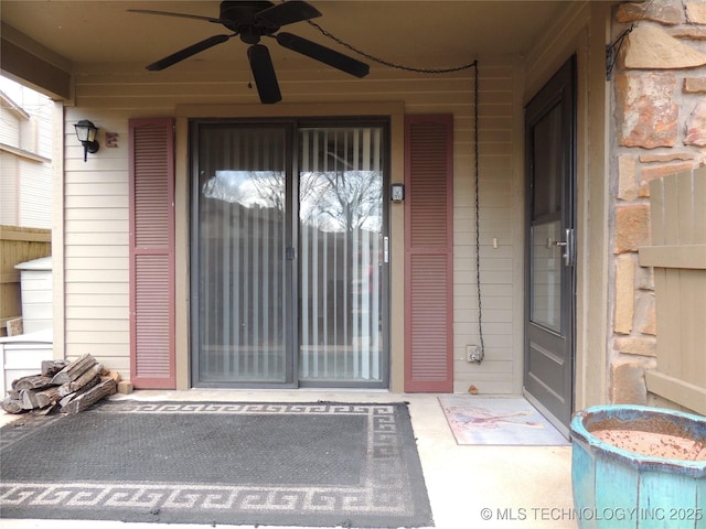 doorway to property with a ceiling fan