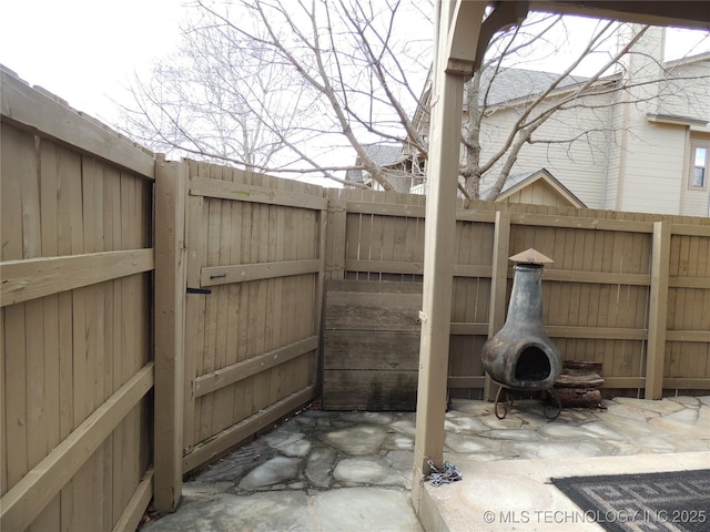 view of patio featuring fence