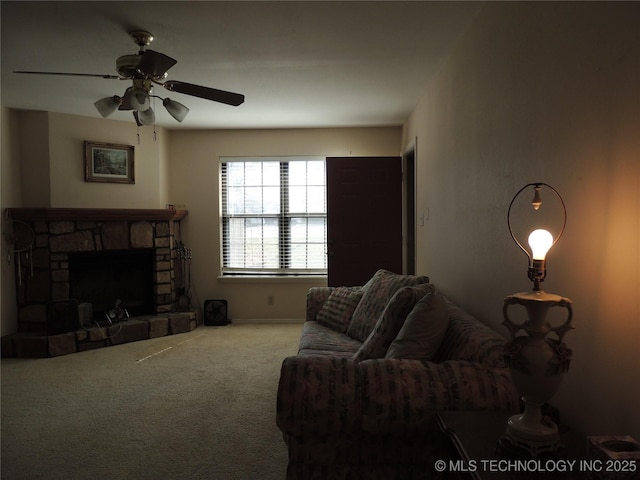 living room with a fireplace, carpet flooring, and a ceiling fan