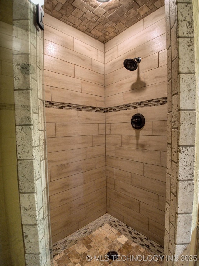 full bath featuring a tile shower