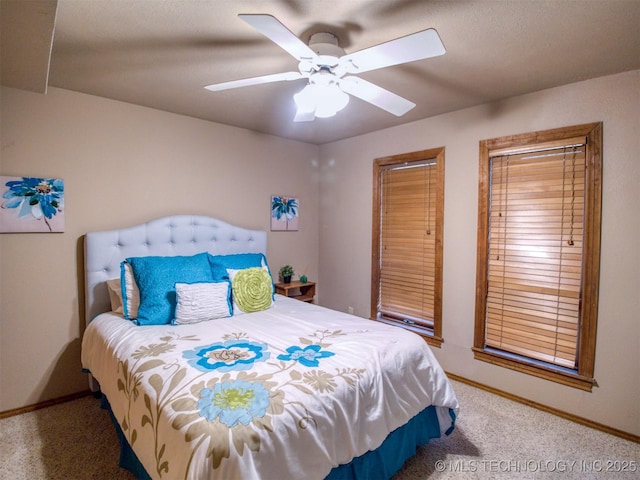 bedroom featuring carpet, baseboards, and ceiling fan