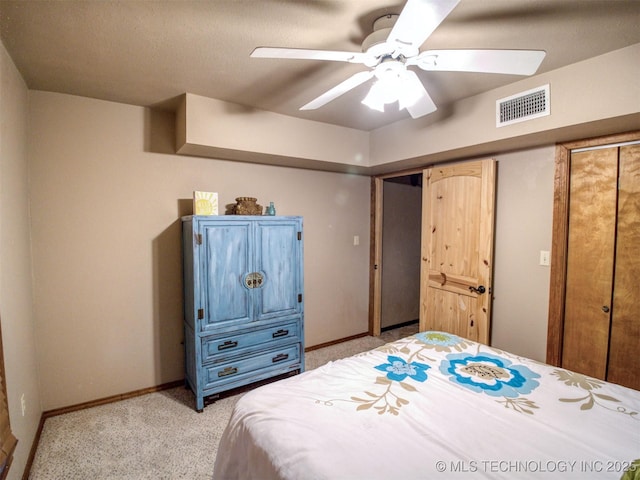 bedroom with baseboards, ceiling fan, visible vents, and light colored carpet