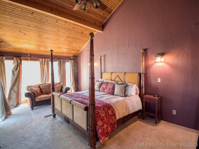 carpeted bedroom with lofted ceiling with beams, wood ceiling, and a textured wall