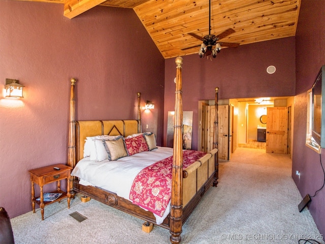 carpeted bedroom with wooden ceiling, visible vents, and high vaulted ceiling