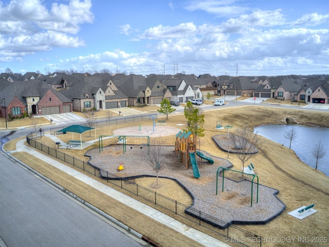 surrounding community with a residential view, fence, and playground community