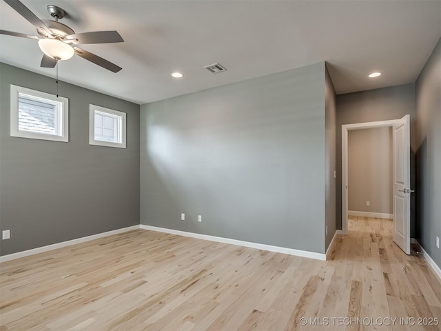 spare room with light wood-style flooring, recessed lighting, visible vents, and baseboards