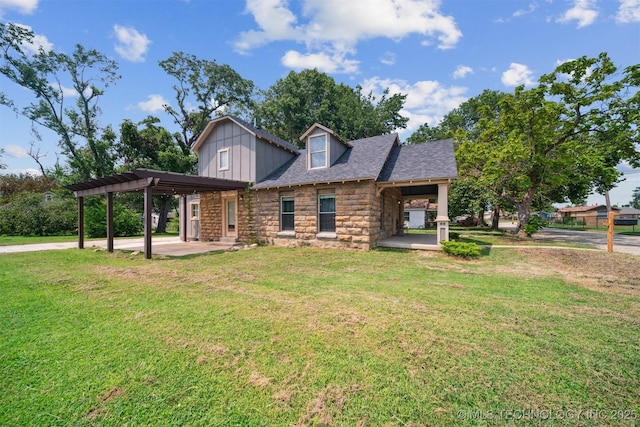 view of front of home with stone siding, a patio area, a front lawn, and a pergola