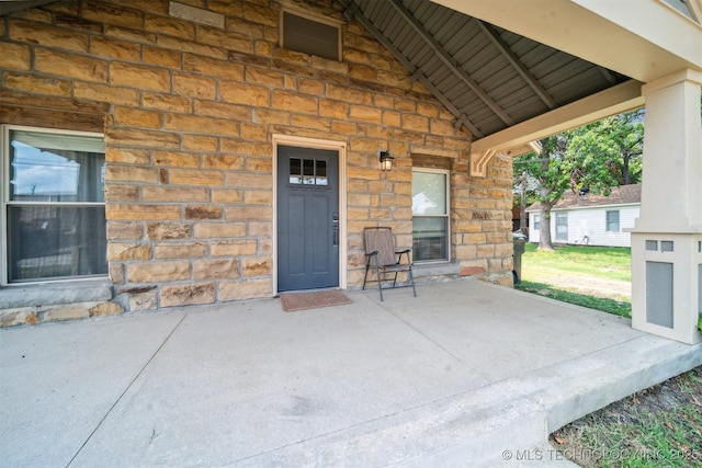 entrance to property with stone siding