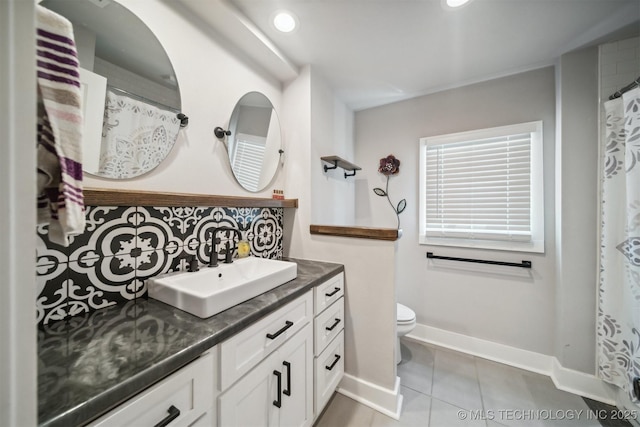 full bath featuring tile patterned flooring, toilet, recessed lighting, vanity, and baseboards