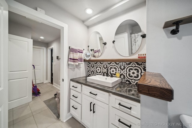 bathroom with recessed lighting, decorative backsplash, vanity, and tile patterned floors