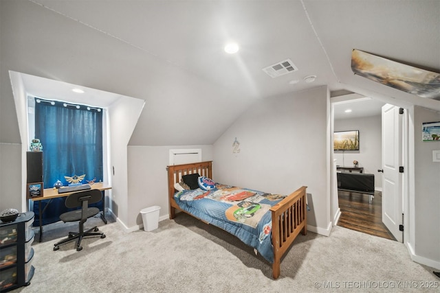 bedroom with lofted ceiling, carpet, visible vents, and baseboards