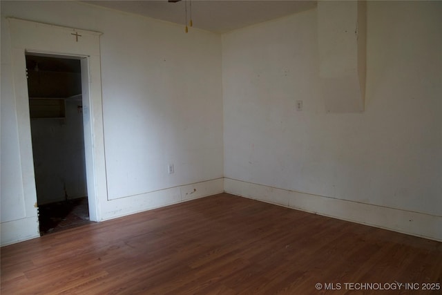 empty room with wood finished floors