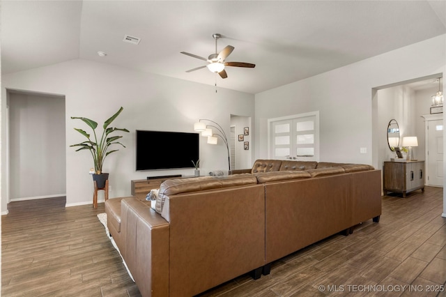 living room featuring baseboards, visible vents, a ceiling fan, lofted ceiling, and wood finished floors