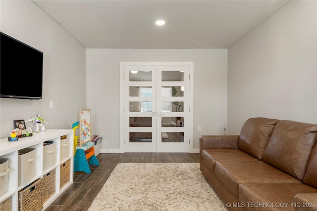 living area with baseboards, french doors, recessed lighting, and wood tiled floor