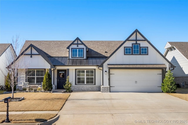 view of front of home with metal roof, a garage, brick siding, driveway, and a standing seam roof