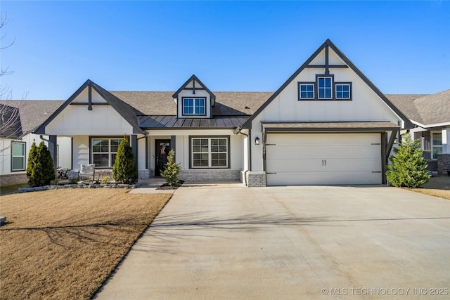 view of front of house featuring brick siding, an attached garage, a standing seam roof, metal roof, and driveway