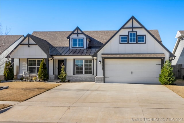 view of front of house featuring a garage, driveway, metal roof, a standing seam roof, and brick siding