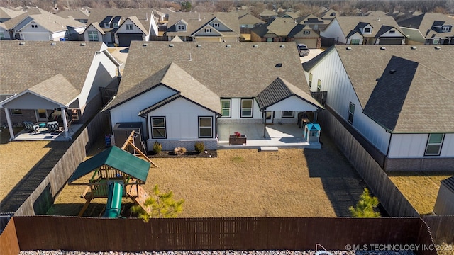 birds eye view of property with a residential view