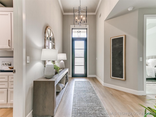 11225 S Fir Ave W, Jenks, OK 74037 - entryway featuring baseboards, light wood-type flooring, a chandelier, and crown molding