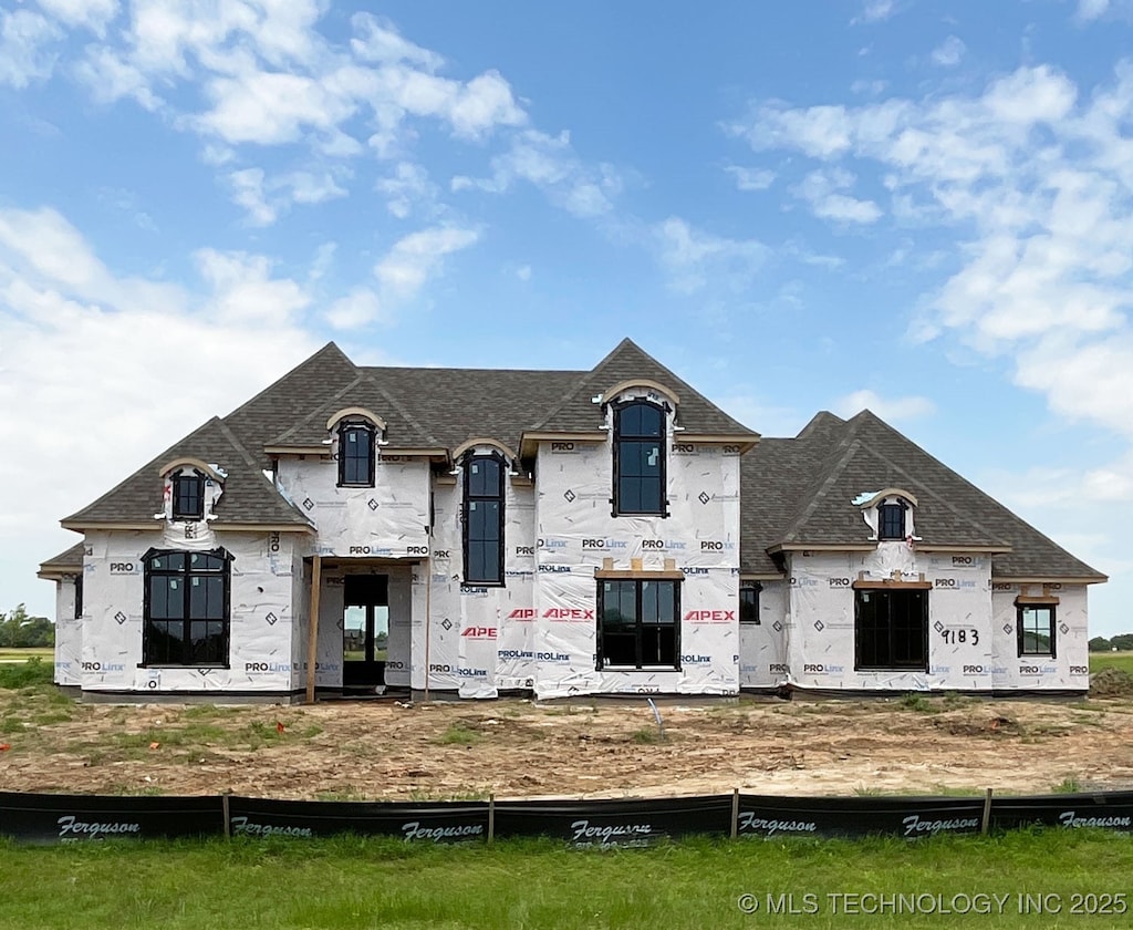 9183 S Timber Wolf Dr, Broken Arrow, OK 74014 - view of front facade featuring roof with shingles