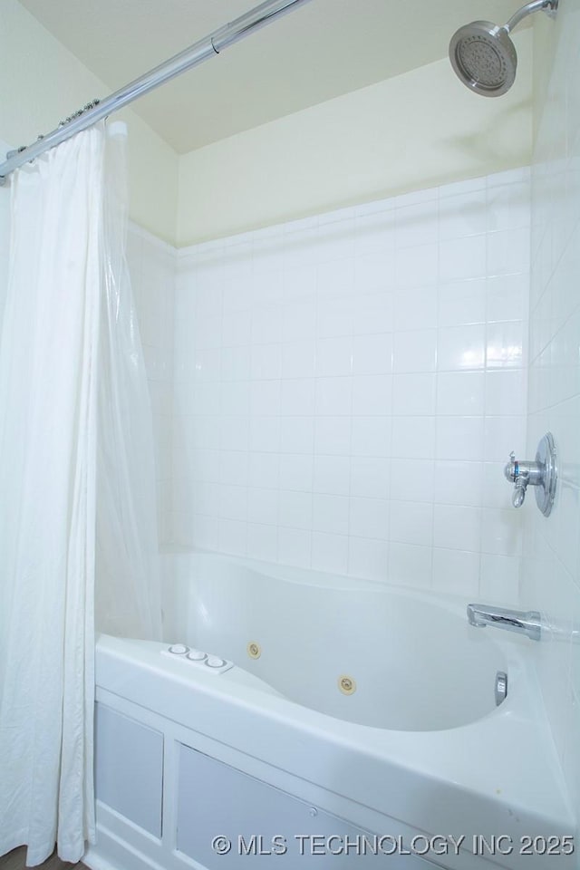 full bath with a combined bath / shower with jetted tub