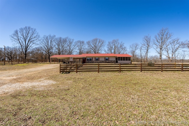 view of stable featuring a rural view