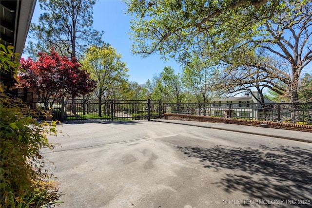 view of patio / terrace featuring fence and a gate