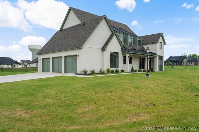 view of home's exterior featuring driveway, a lawn, roof with shingles, fence, and brick siding