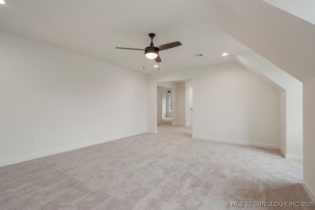 bonus room with recessed lighting, light carpet, lofted ceiling, and baseboards