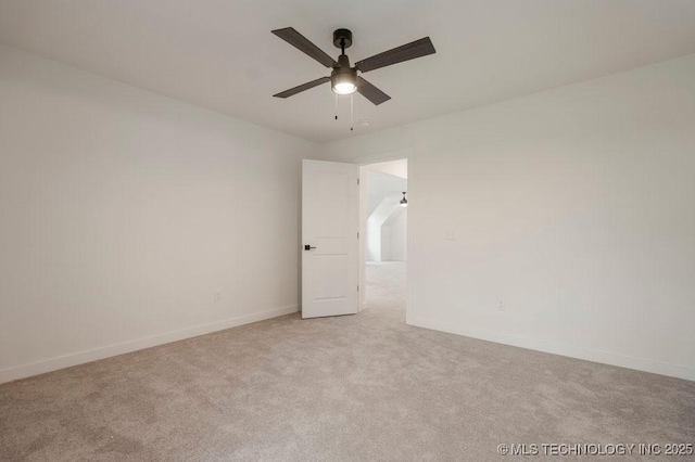 unfurnished room with baseboards, a ceiling fan, and light colored carpet