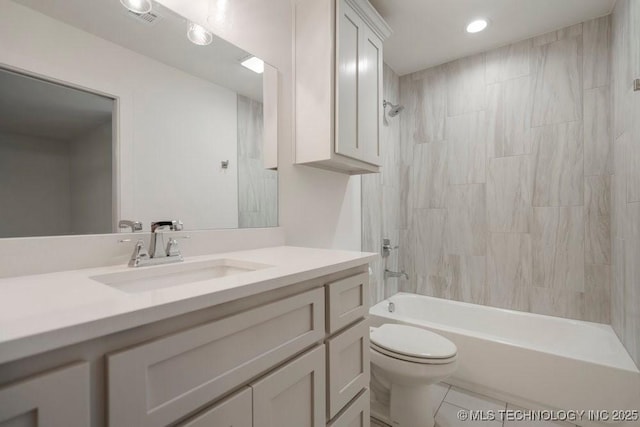 bathroom with bathtub / shower combination, visible vents, toilet, vanity, and tile patterned floors