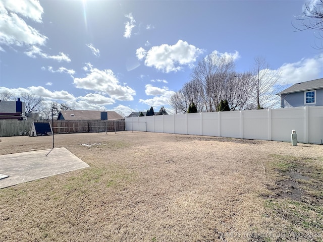 view of yard with a fenced backyard and a patio