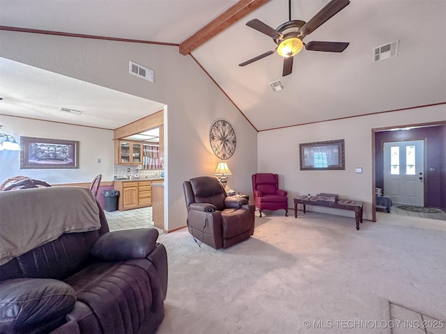 living area featuring high vaulted ceiling, beamed ceiling, visible vents, and light colored carpet