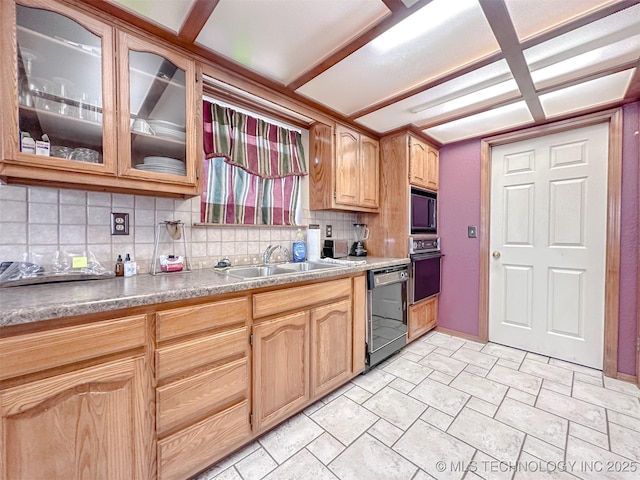 kitchen with backsplash, glass insert cabinets, light brown cabinets, a sink, and black appliances