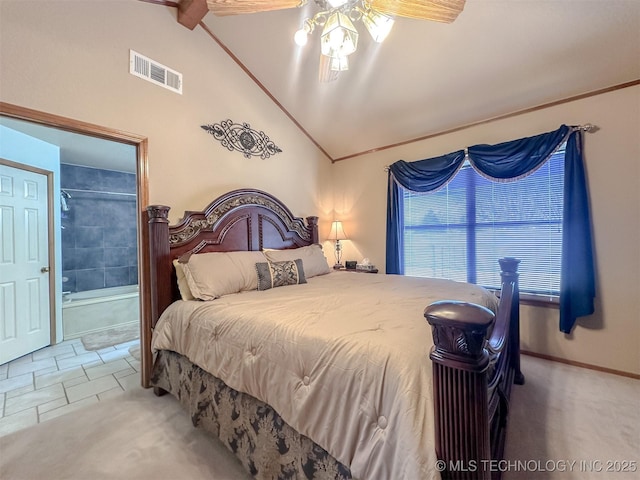 bedroom featuring visible vents, baseboards, ensuite bath, carpet floors, and high vaulted ceiling