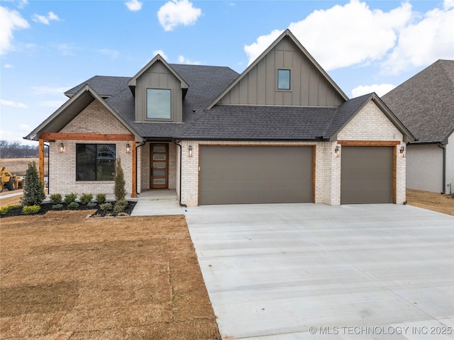 view of front of home featuring a garage, roof with shingles, concrete driveway, and brick siding