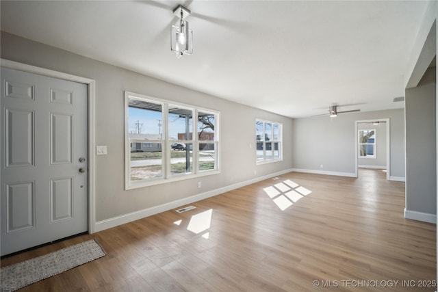 8301 E 133rd St S, Bixby, OK 74008 - entrance foyer with baseboards, ceiling fan, light wood finished floors, and visible vents