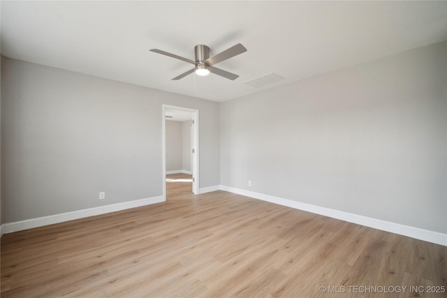 8301 E 133rd St S, Bixby, OK 74008 - spare room featuring a ceiling fan, baseboards, visible vents, and light wood-style flooring