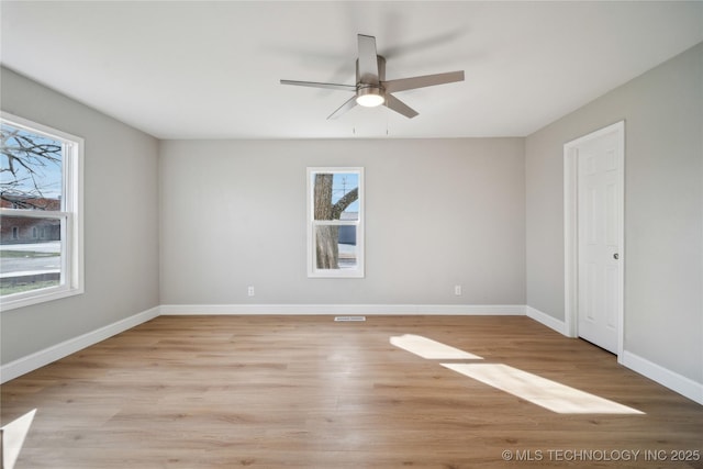8301 E 133rd St S, Bixby, OK 74008 - empty room with baseboards, ceiling fan, light wood finished floors, and visible vents