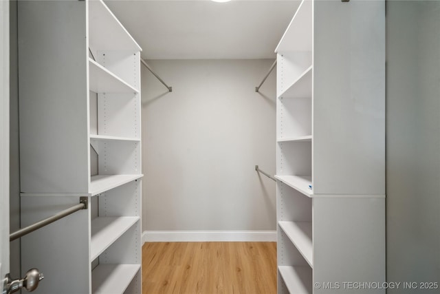 8301 E 133rd St S, Bixby, OK 74008 - walk in closet featuring wood finished floors