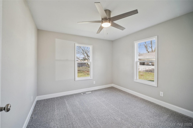 8301 E 133rd St S, Bixby, OK 74008 - carpeted empty room with a ceiling fan, baseboards, visible vents, and plenty of natural light
